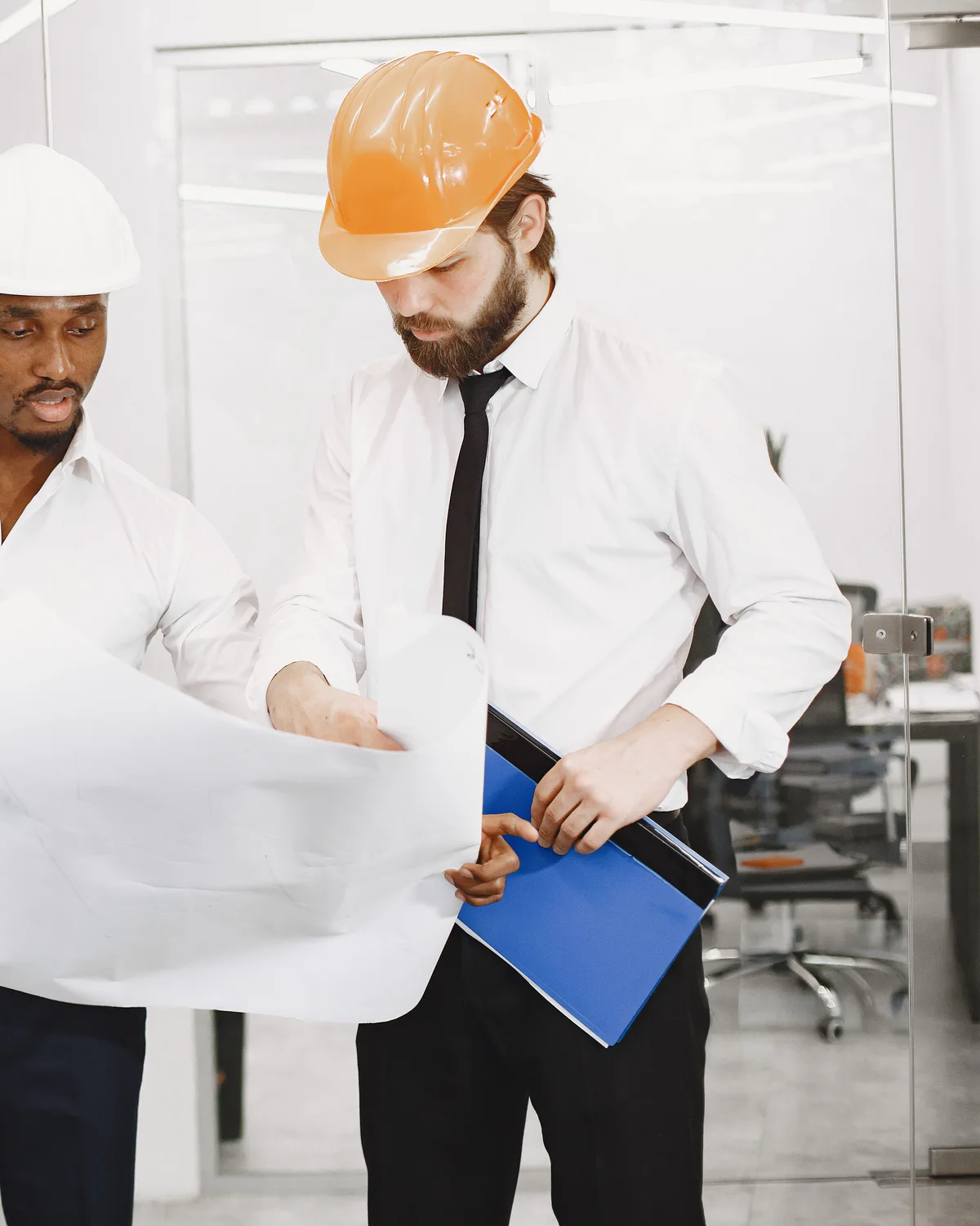Technical professionals reviewing construction plans