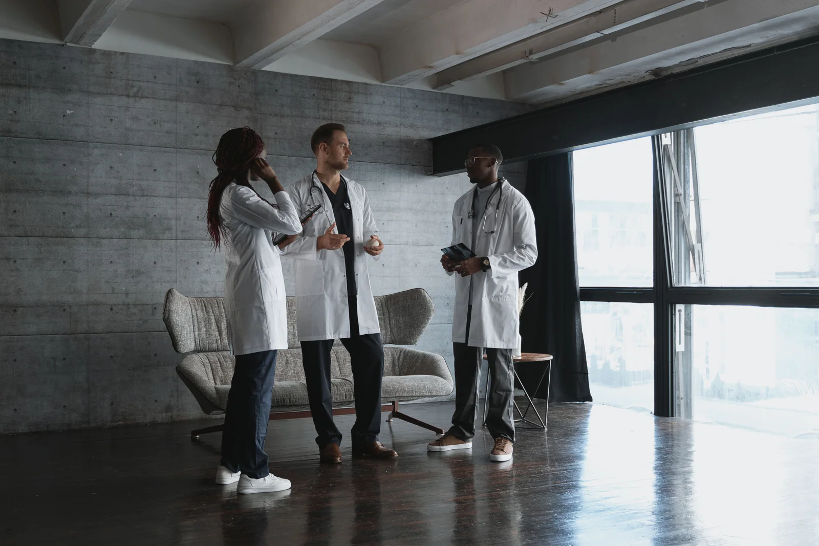 Diverse healthcare team consulting in a modern workspace